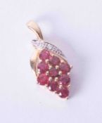 A 9ct yellow gold marquise shaped diamond and ruby set pendant, 2.20g, total length 28mm.