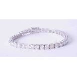 A stunning 18ct white gold diamond line bracelet, approx. total weight 12.60 carats, 38 diamonds,