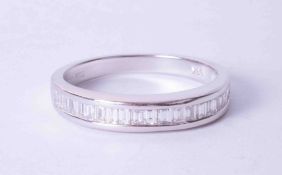 An 18ct white gold half eternity ring channel set with baguette cut diamonds, finger size Q.