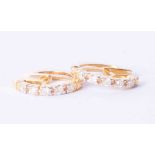 A pair of 9ct yellow gold hoop earrings set approx. 0.60 carat (total weight) of diamonds, 4g.