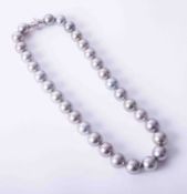 A rare strand of fine large grey Tahitian pearls, the largest pearl being approx. 13mm, with a