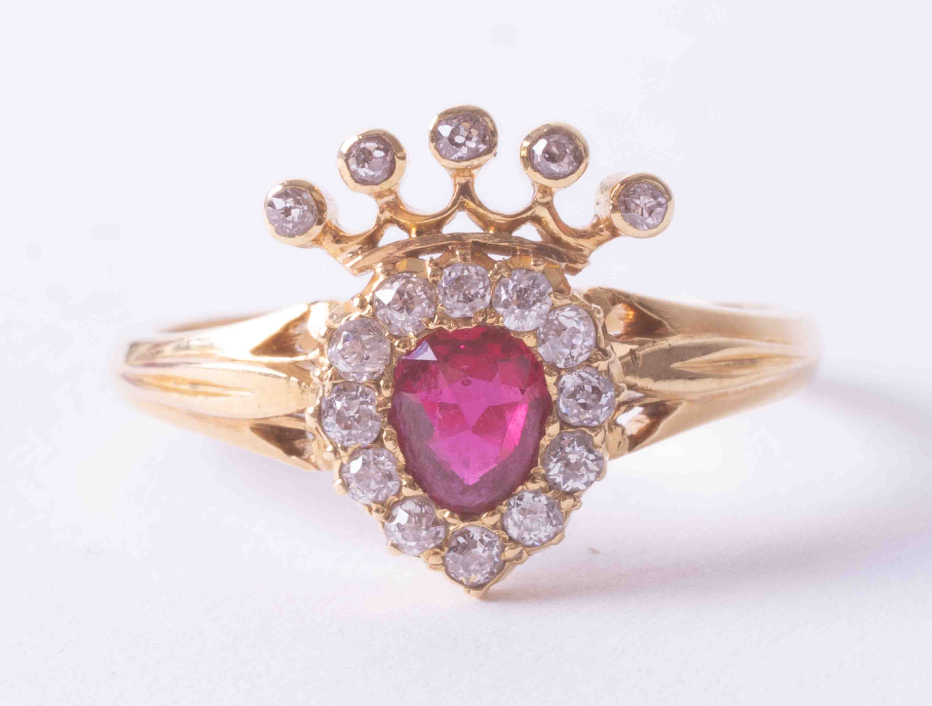 A Victorian 18ct yellow gold heart shaped Claddagh ring set oval ruby, approx. 0.35 carats