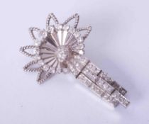 A fine French Art Deco starburst design diamond set brooch.