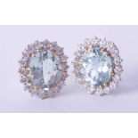 A pair of fine 18ct white & yellow gold aquamarine and diamond cluster earrings, approx. 17mm x