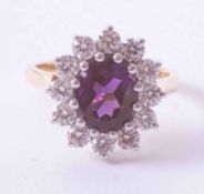 An impressive 18ct yellow & white gold cluster ring set approx. 2.33 carat of oval cut amethyst