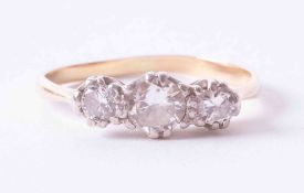 A classic 18ct yellow gold three stone diamond ring set approx. 0.55 carat total weight, finger size