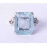 An impressive 18ct white gold ring set with an octagonal step cut Aquamarine, estimated weight 14