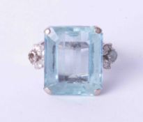 An impressive 18ct white gold ring set with an octagonal step cut Aquamarine, estimated weight 14