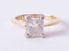 An 18ct yellow & white gold ring set with 1.60 carat Princess cut diamond, colour J, clarity VVS2,