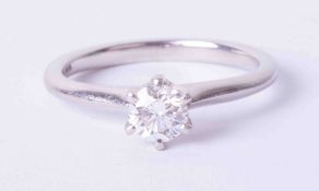 A platinum six claw solitaire ring set 0.50 carat round brilliant cut diamond, colour E, clarity VS1