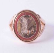 An antique 9ct rose gold signet style ring set with a mosaic of a resting dog, finger size M.