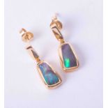 A pair of modern 18ct yellow gold drop earrings set black opal with butterfly backs, approx. 3.40g.