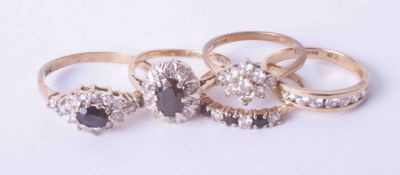 A 9ct yellow gold gem set cluster ring with four other 9ct yellow gold gem set rings, 9.6g (5)