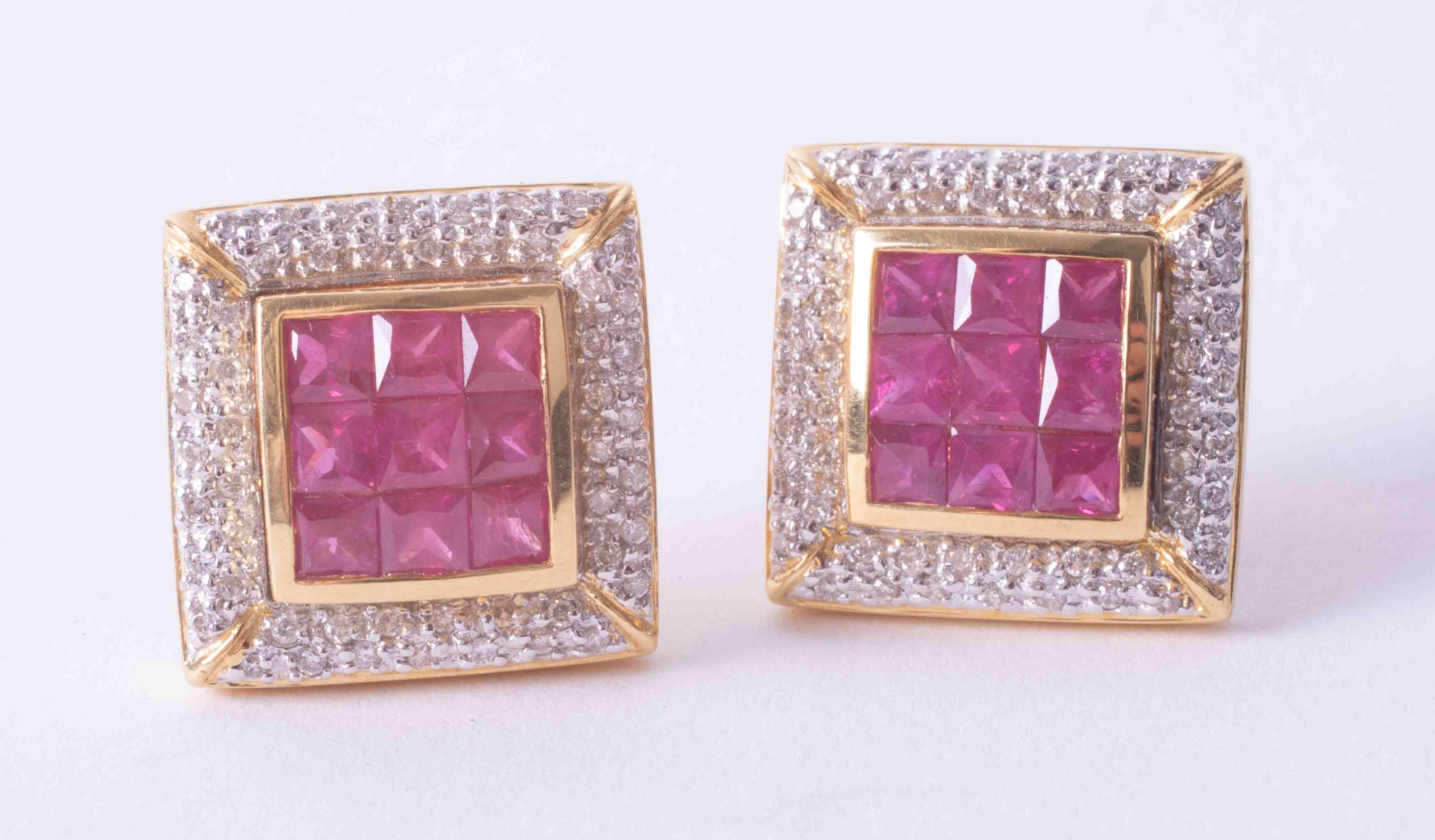 A pair of impressive 18ct yellow gold large square earrings set princess cut rubies and surrounded