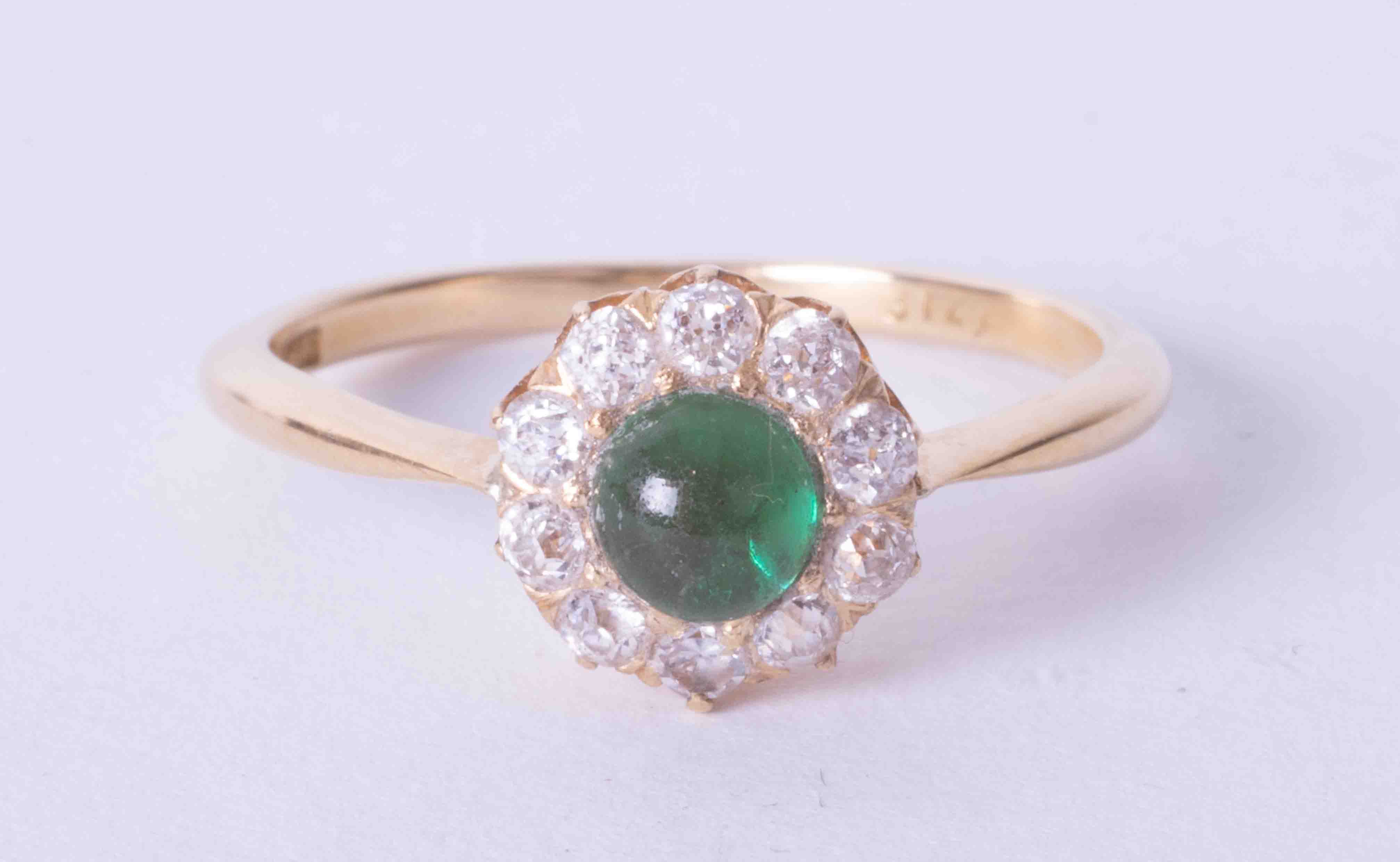 An antique 18ct yellow gold cabochon emerald and diamond cluster ring, (the emerald approx. 5mm