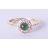 An antique 18ct yellow gold cabochon emerald and diamond cluster ring, (the emerald approx. 5mm