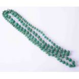 A string of green jadeite beads, approx. weight 125g.