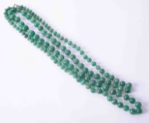 A string of green jadeite beads, approx. weight 125g.