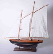 A model of a Racing Yacht on stand.