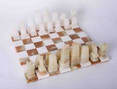 A modern marble chess set and board (damage to the board).