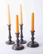 Two pairs of silver candlesticks, the tallest 17cm.