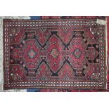 A Persian rug, length 159cm.
