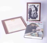 A collection of John Wayne memorabilia including John Wayne My Father book, John Wayne framed