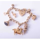 A 9ct gold charm bracelet and various charms (7), approx. 46.7g.