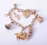 A 9ct gold charm bracelet and various charms (7), approx. 46.7g.