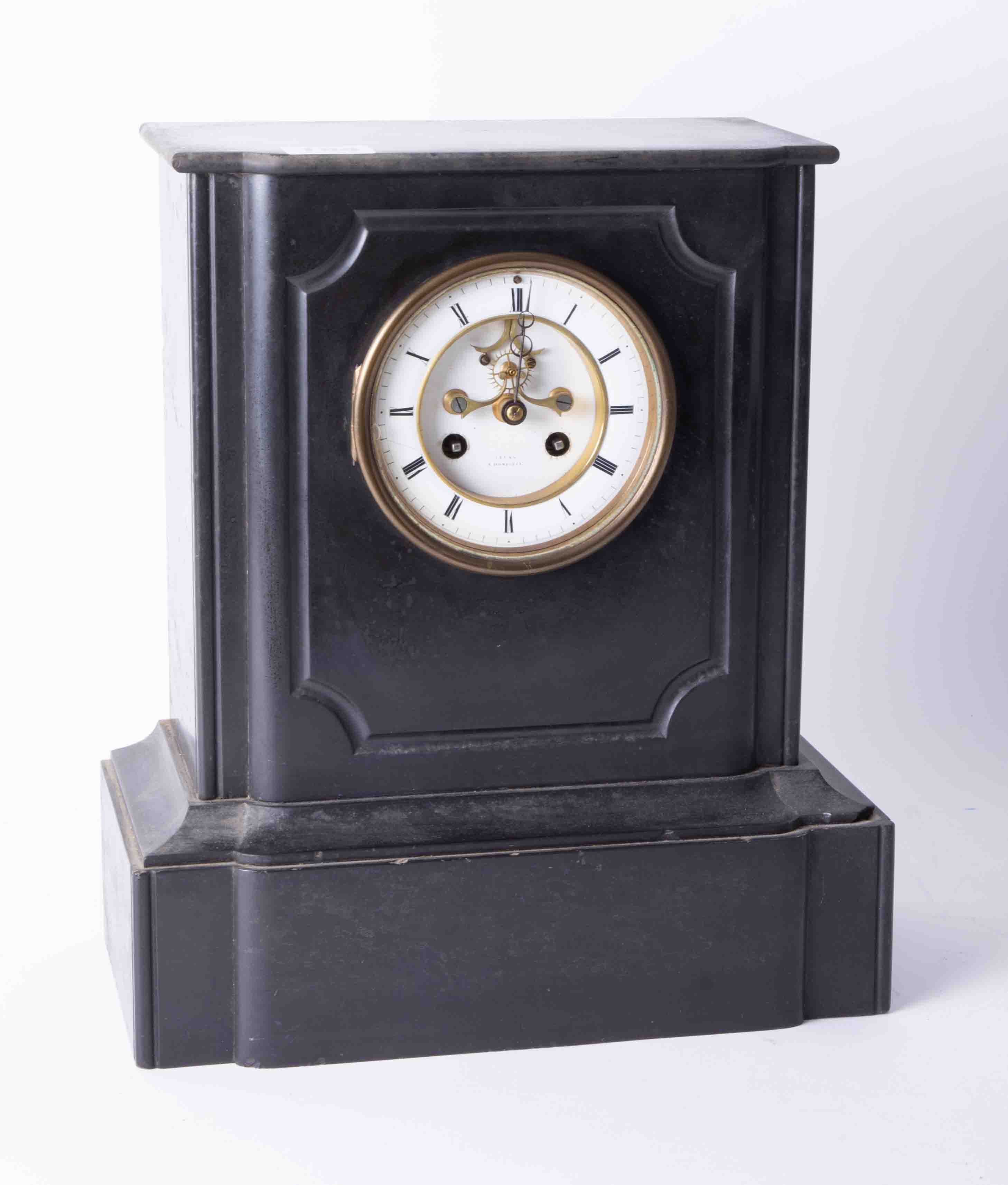A Victorian heavy black slate cased clock, the dial marked Elgon with escapement window and bell