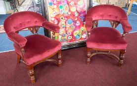 A pair of mahogany framed and upholstered tub open armchairs.