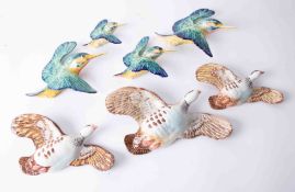 A set of three Beswick graduated flying birds together with a set of four Beswick flying