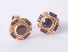 A pair of 18ct yellow gold dark blue sapphire & small diamond cluster earrings, approx. 4.3g.