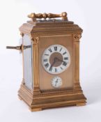 A good French brass cased carriage clock with repeat movement striking on a bell with two dials with