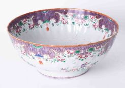 An antique Chinese porcelain bowl decorated with flowers and gilt borders, diameter 29cm.