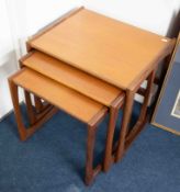 Nest of three teak tables.