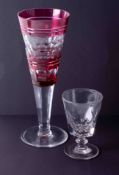 A large Bohemian? Cranberry glass goblet, height 28cm together with a drinking glass early 20th