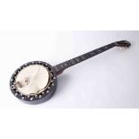 A Clifford Essex banjo, six string banjo, with engraved pearl headstock and fingerboard, stamped '