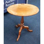 A 19th Century mahogany tripod wine table with tip up top.