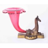 A bronze and cranberry cornucopia epergne vase modelled in the form of a giraffe, the base marked "