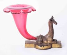 A bronze and cranberry cornucopia epergne vase modelled in the form of a giraffe, the base marked "