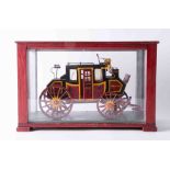 A cased model of a Stage Coach, 'Coventry to Chester', the cabinet 39cm x 25cm x 18cm.