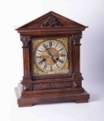 A German architecture wood cased clock, 14 day strike on gong with pendulum and key, height 39cm.