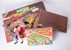 A 1980's Britain's Farm play base, Merit Weaving Loom, Pelham Wizard puppet and Goldon