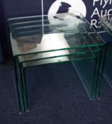 A nest of three modern Contemporary glass tables (3).