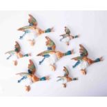 A collection of 7 various size Beswick flying ducks, the largest model 596, length 25cm.