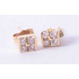 A pair 18k yellow gold earrings, each set with four diamonds, approx. 1.3g.