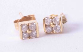 A pair 18k yellow gold earrings, each set with four diamonds, approx. 1.3g.