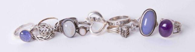 Twelve assorted silver dress rings.