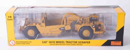 CAT 657G Wheel Tractor Scraper 1:50 scale, boxed.